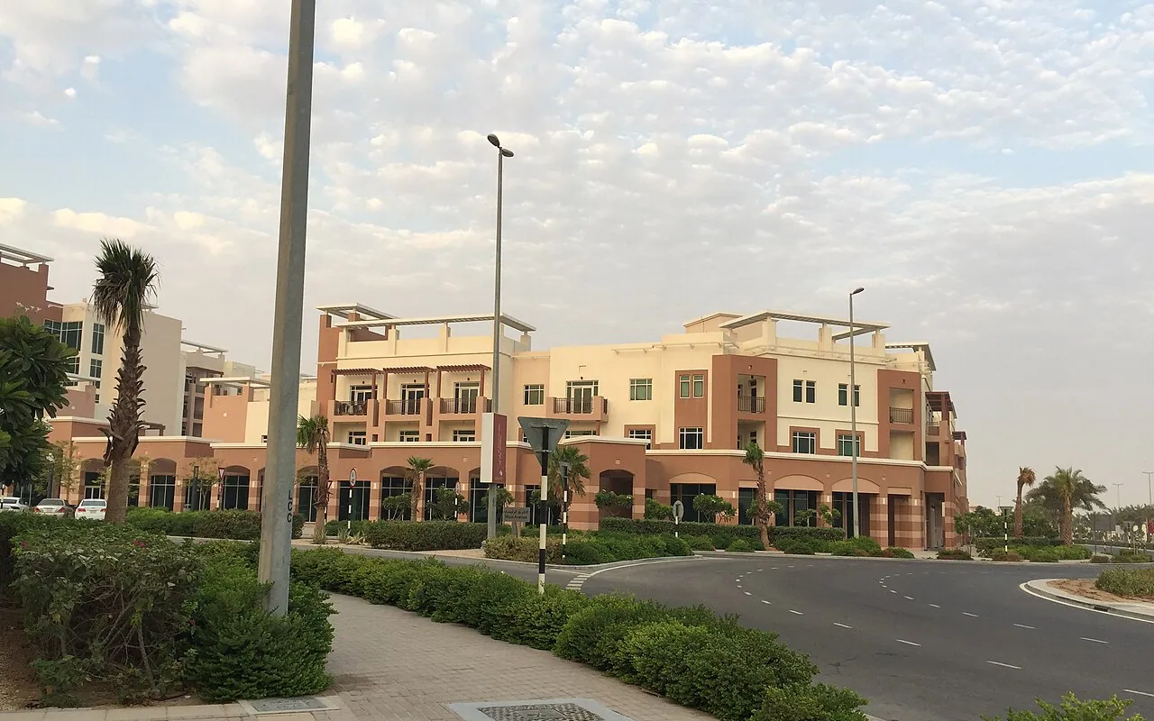 Representative Abu Dhabi community photograph: low-rise apartments and landscaping in Al Ghadeer
