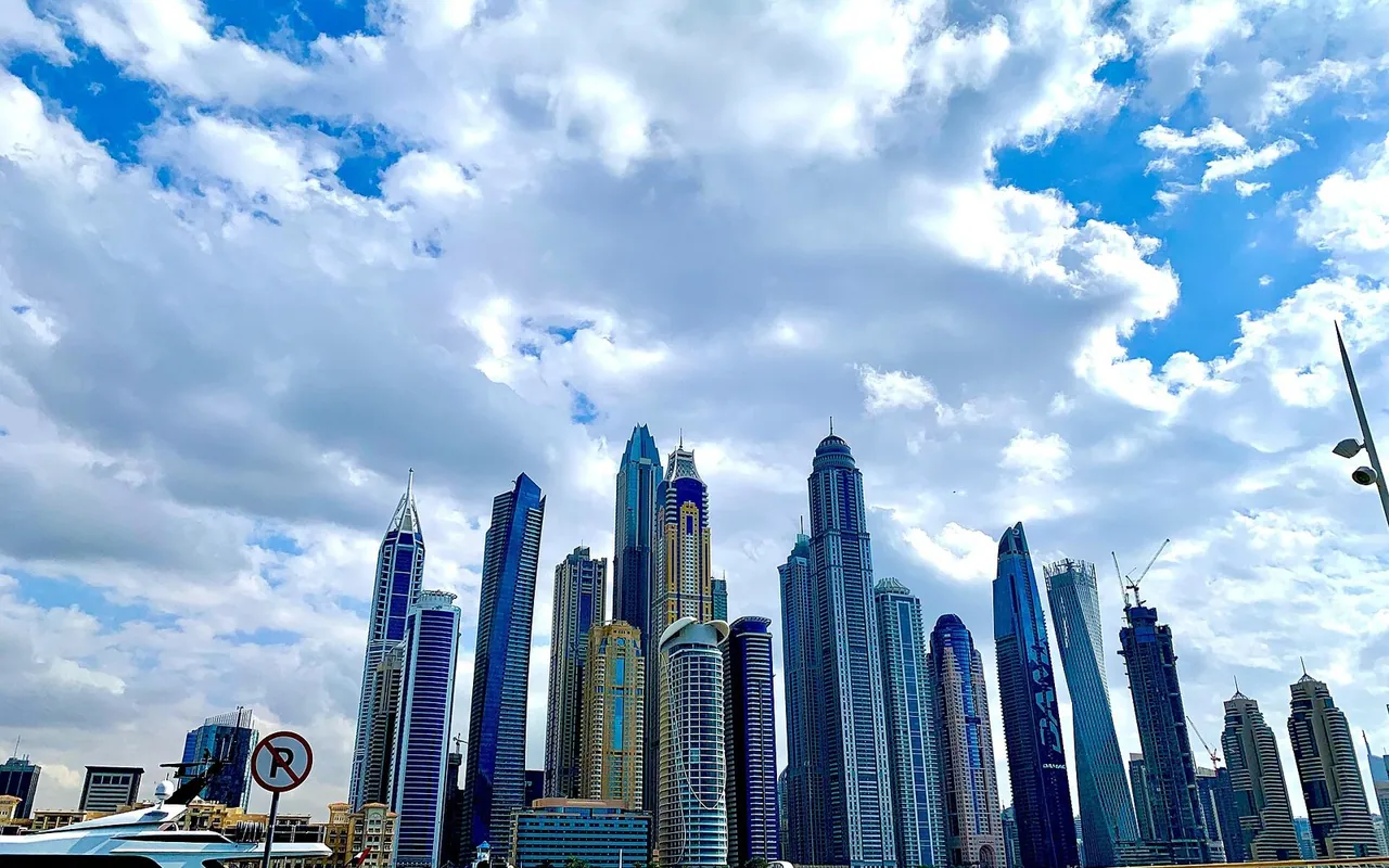 Dubai Marina towers and yachts viewed from Dubai Harbour