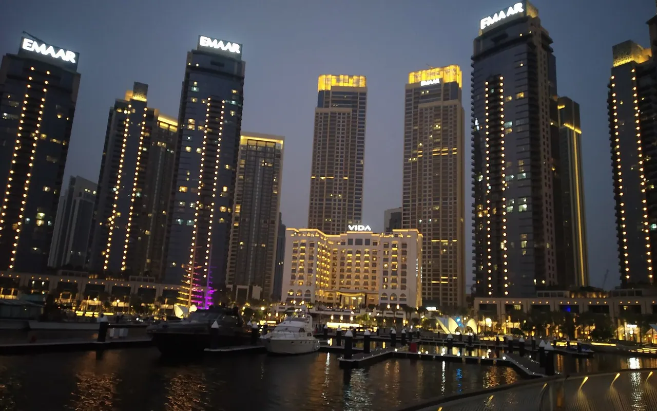 Dubai Creek Harbour waterfront towers and marina at night