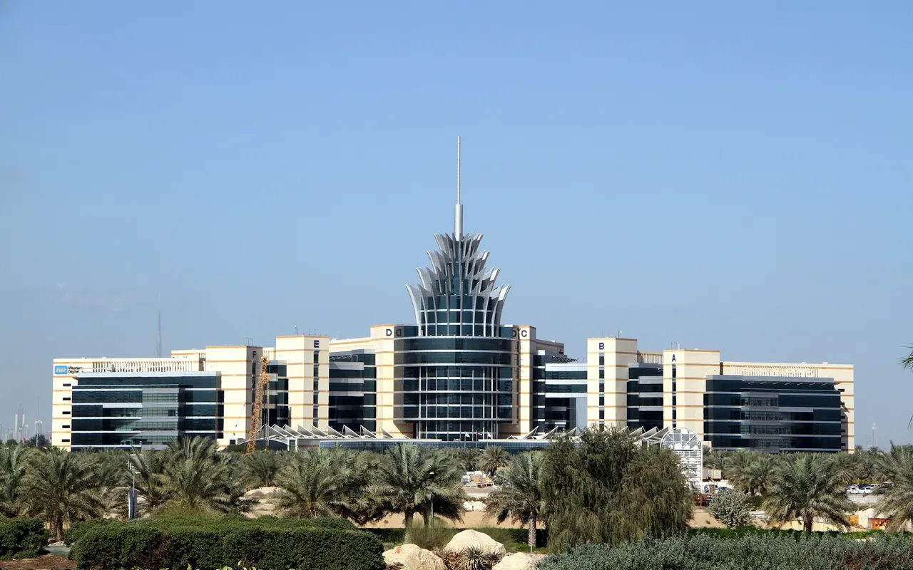 Dubai Silicon Oasis Authority headquarters with its central spire and palm-lined gardens