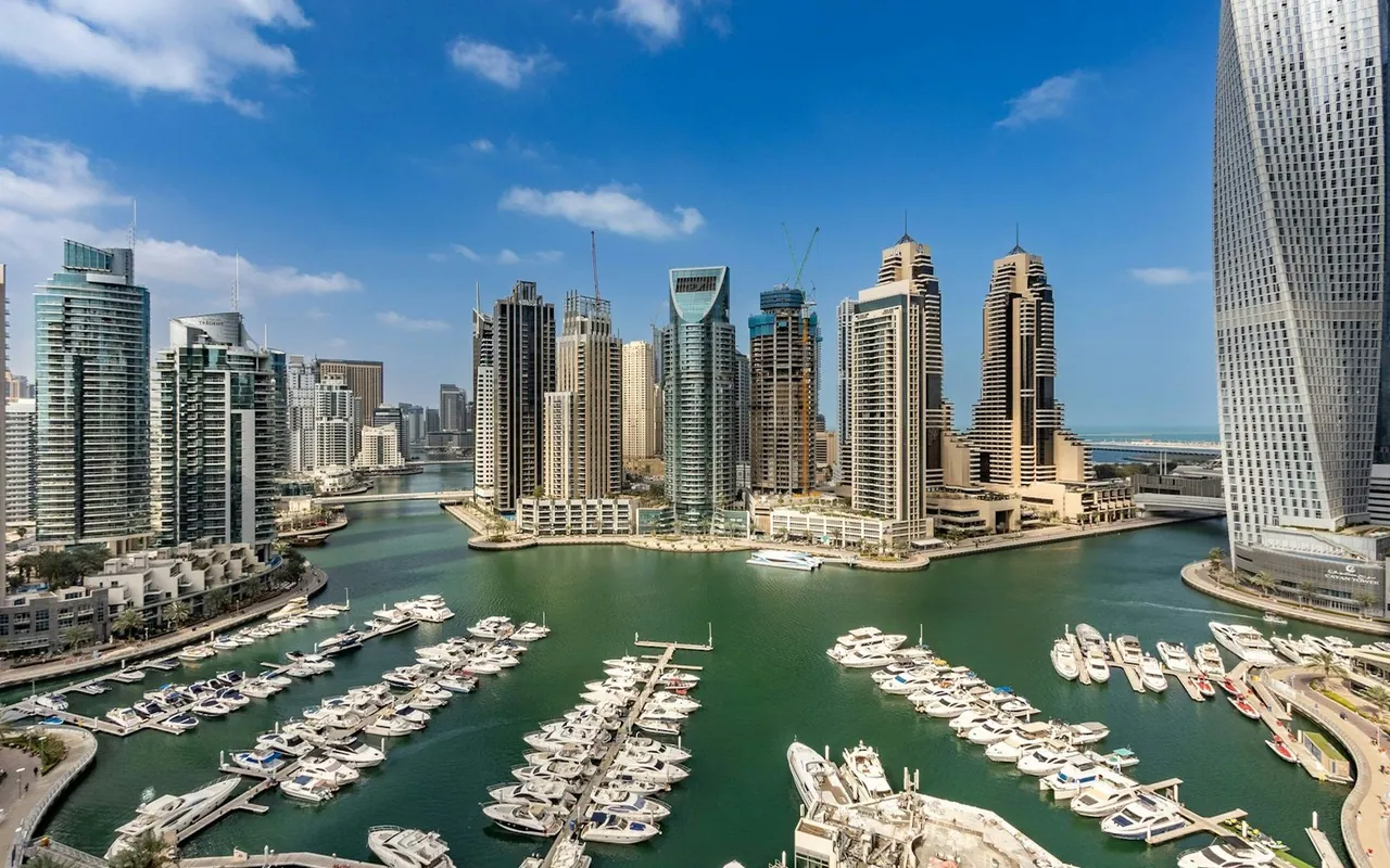 Yachts and waterfront apartment towers in Dubai Marina