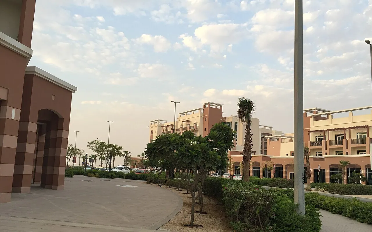 Walkways, trees and low-rise apartments in Al Ghadeer