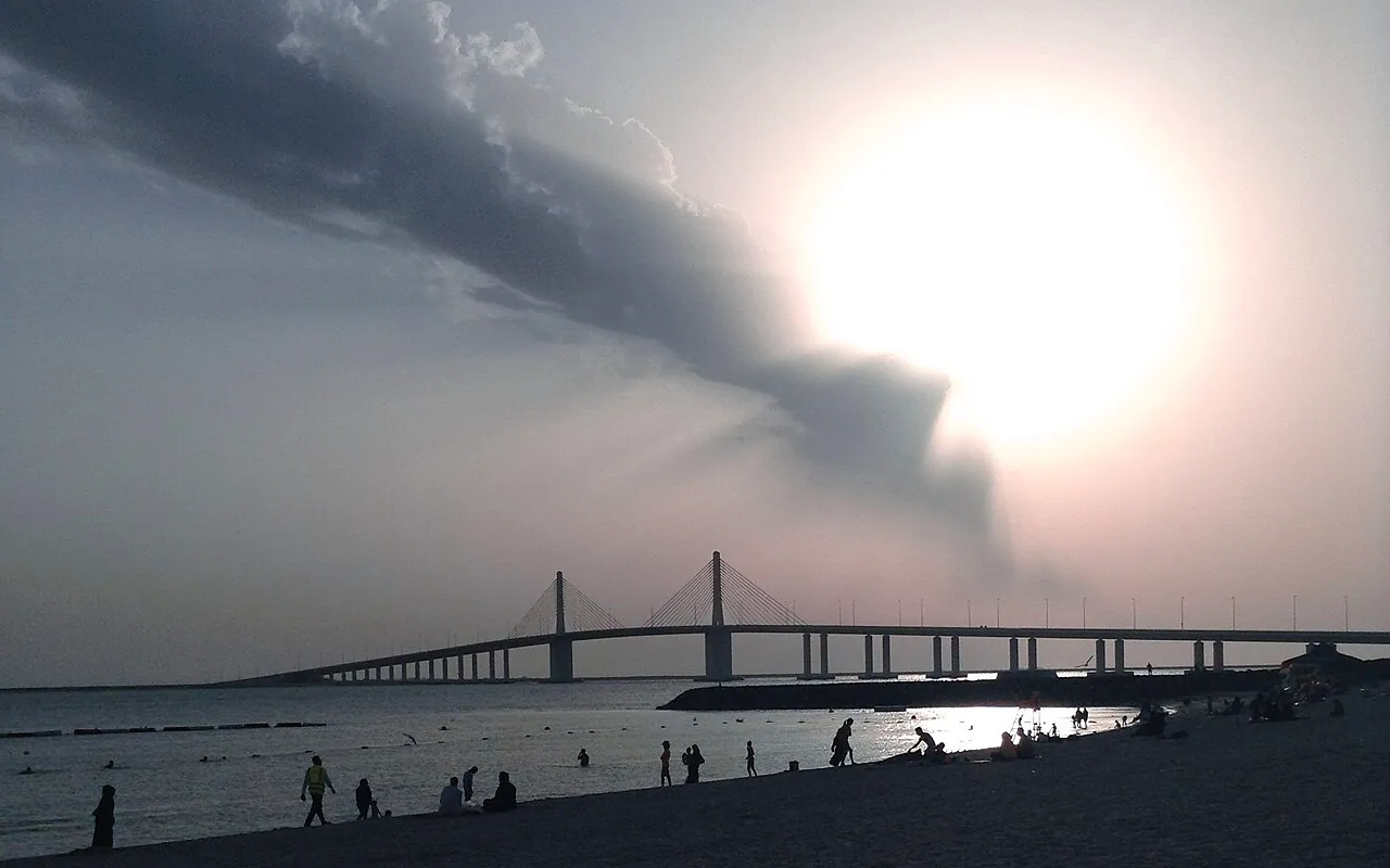 Al Bateen Beach at sunset with Hudayriyat Bridge in the distance